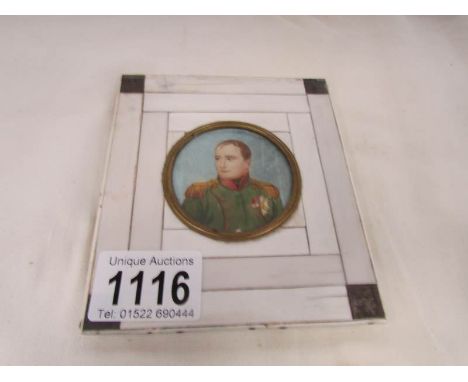 A framed miniature portrait of Napoleon