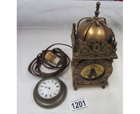 A brass lantern clock and one other