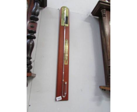 A modern mahogany stick barometer