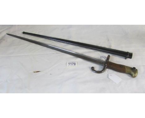 A French model 1874 'Gras' bayonet engraved Mre D'Armes de St. Etienne, Aout 1876, with scabbard (numbers do not match)