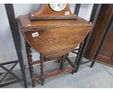 An oak barley twist gate leg table
