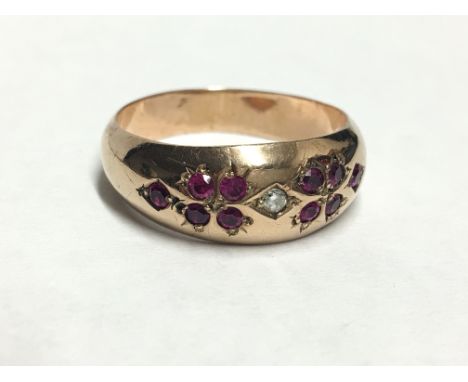 A diamond and ruby set 9ct gold ring, hall marked for Chester 1910