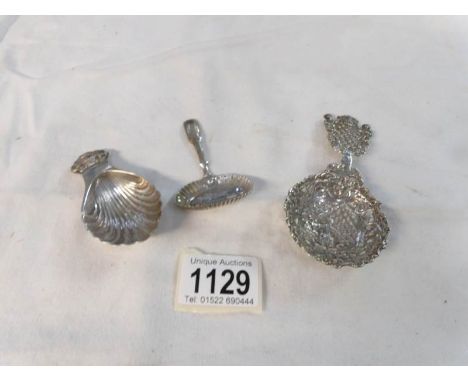 A continental silver sugar sifter spoon (32 gms), a Georgian 1891/20 jam spoon and a silver caddy spoon (2 = 28 gms)