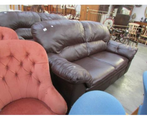 A dark brown leather sofa