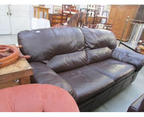 A dark brown leather sofa