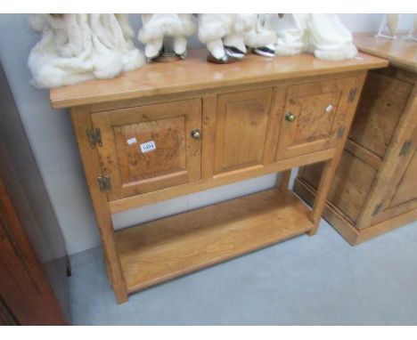 A solid pippy oak 2 door console table