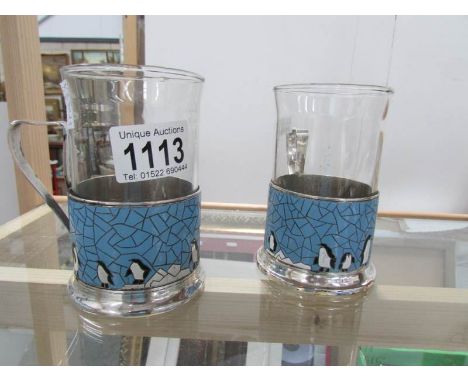 A pair of Russian enamel coffee cans stamped 'Made in USSR' with glass liners