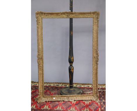 A Chinese-style black, gold and red painted wooden standard lamp (lacking shade) two small rugs and a gilt picture frame (int