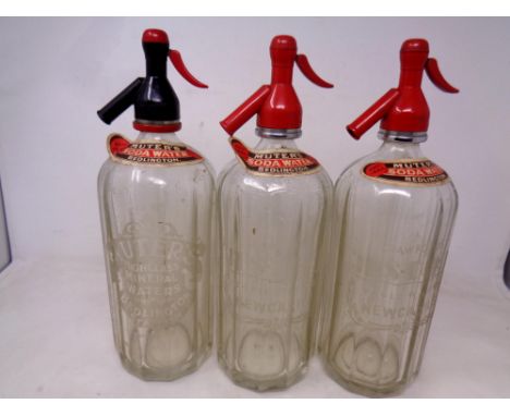Three vintage Muters Soda Water siphons, bearing writing Muters High Class Mineral Waters, Bedlington Station and Crawford Je