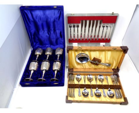 Two canteens of stainless steel cutlery and a further boxed set of six goblets 