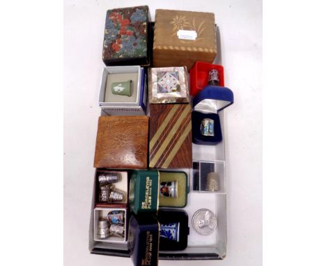 A tray of silver and china thimbles and trinket boxes etc