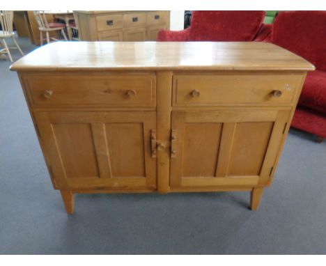 An Ercol elm and beech double door sideboard fitted two drawers