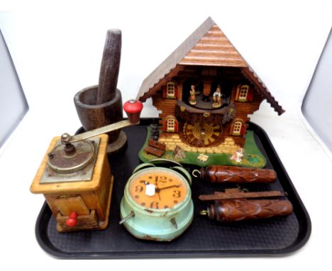 A tray of cuckoo clock, wood mortar and pestle, coffee grinder, vintage alarm clock 