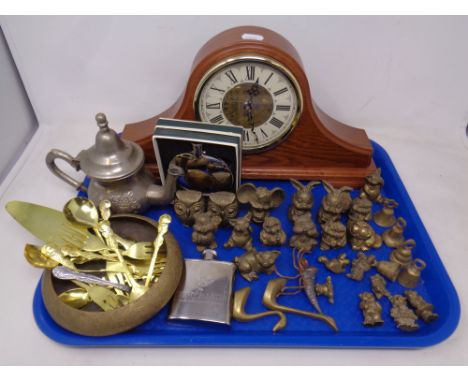 A tray of brass animal ornaments, miniature bells, teapot, two hip flasks, mantel clock  