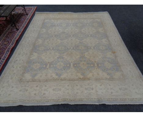 A Persian design carpet on beige ground, 294cm by 248cm 