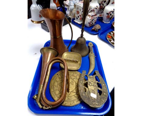 A tray of assorted brass and copper wares - hunting horn, jug, hand bell, Persian dagger in sheath, trivet etc 