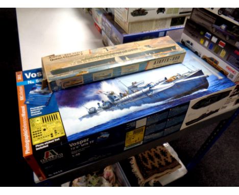 An Airfix 600 scale Queen Elizabeth II model kit together with a Italeri 1:35 scale Vosper MTB 77 boat