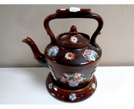 A 19th century barge ware teapot on stand 