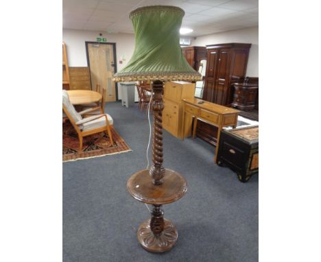 A carved beech barley twist standard lamp/occasional table with tasselled shade 
