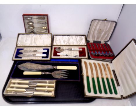 A tray of boxed cutlery sets, cased pair of EPNS fish servers, set of Viners spoons etc 