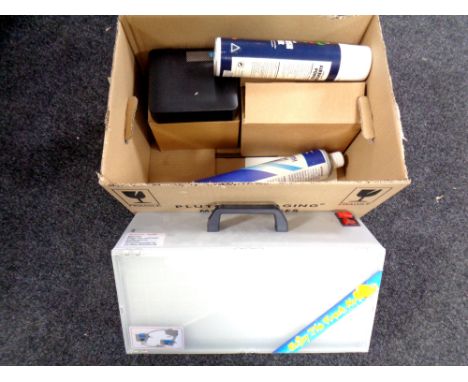 A box of Airbrush compressor and booth for model kit painting 