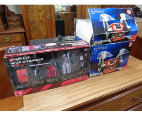 A Parkside 200 W bench grinder and a Parkside air tool accessories set, boxed 