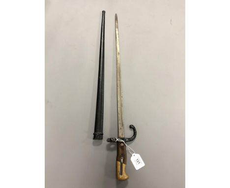 A 19th century French Gras rifle epee bayonet, dated 1879, in metal scabbard 