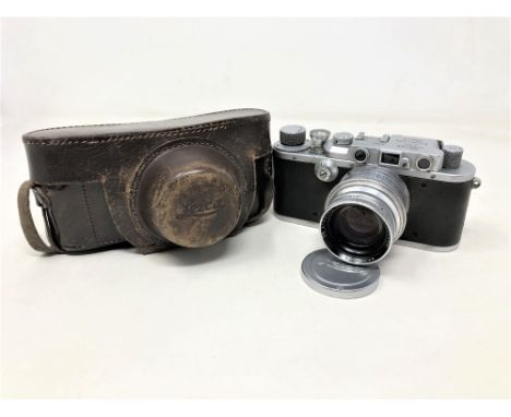 A Leica Ernst Leitz Wetzlar camera numbered 228,805, with Ross of London Xtralux F/2 lens number 199,108, in Cooke & Perkins 