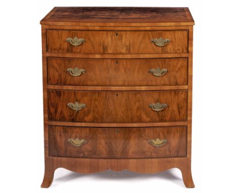 The book-veneered crossbanded top above four long graduated drawers, on French bracket feet91,5cm high, 77cm wide, 48cm deep