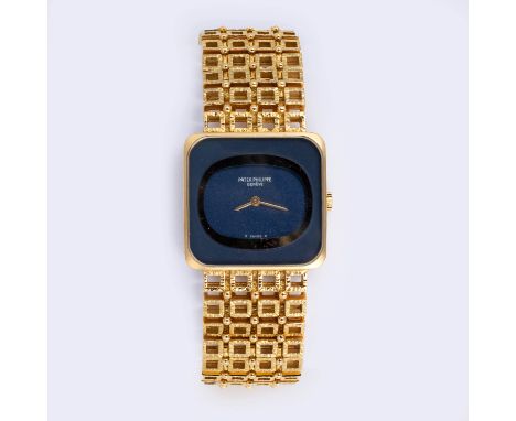 Reference number 4183/1, movement number 1 261 988, the rectangular deep blue dial with oval inner surround, on an 18ct gold 