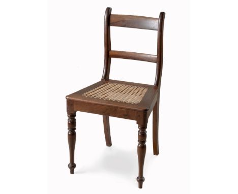 The curved top and mid rail between shaped supports, caned seat, on ring-turned tapering legs