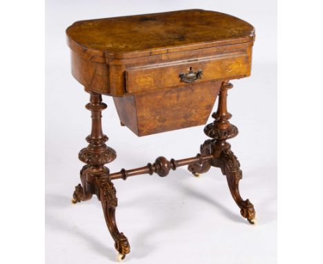 The shaped rectangular quarter-veneered hinged swivel top enclosing a chess and backgammon board above a frieze drawer, a sli