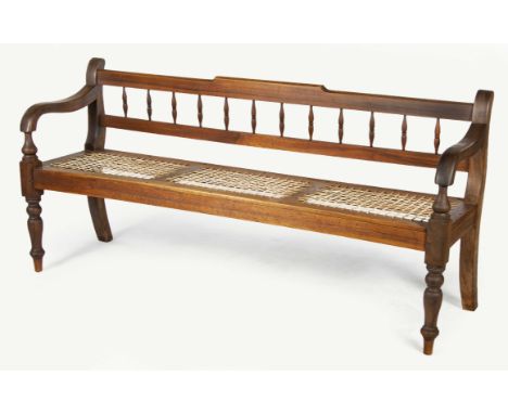 The shaped top and plain mid rail joined by turned spindles, downswept arms on upturned baluster supports, three division rie