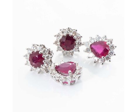 Each surmount claw set to the centre with a round mixed-cut ruby enclosed within a conforming surround of round brilliant-cut