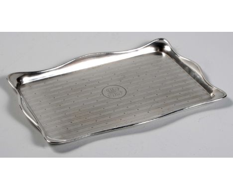 Rectangular, fold over serpentine rim, engine turned surface, the centre engraved with the initials GW in a circular cartouch