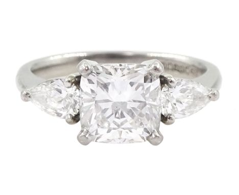 Platinum three stone diamond ring, the central cushion cut diamond of 2.01 carat, G colour, SI1 clarity, with a pear cut diam