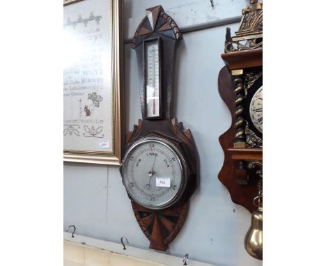 A 1930s oak barometer. 