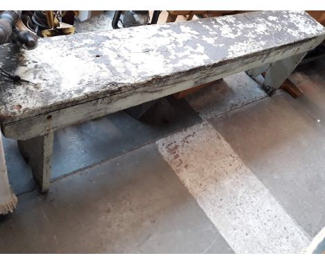 A rustic wooden bench. 