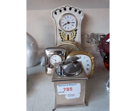 Four small clocks and a lighter 
