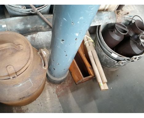 A mixed lot comprising a yolk, a lidded metal churn, a wooden tray, three wooden axe handles and a galvanised bucket containi