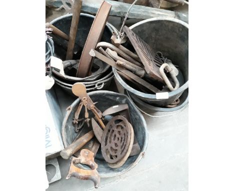 Various buckets containing tools and hardware. 