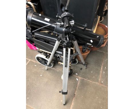 An Optus telescope with lenses and tripod 
