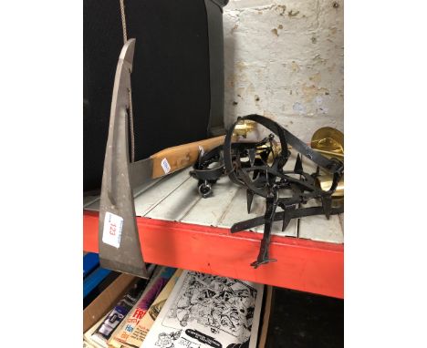 An ice axe and a pair of crampons 
