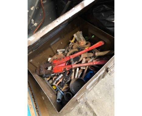 A metal toolbox with tools 