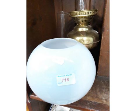 A brass lamp including shade and flue. 