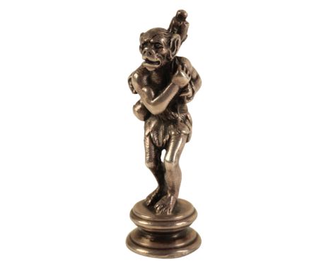 A VICTORIAN SILVER DESK SEAL by John Round, Sheffield 1898, modelled as an Apeman carrying a bundle of sticks across his shou