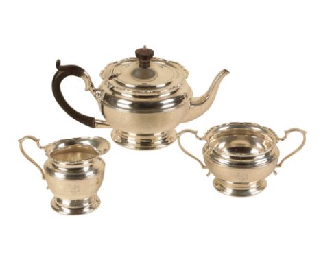 A GEORGE V SILVER TEA SERVICE by Mappin &amp; Webb, Birmingham 1922, comprising teapot, sucrier and milk jug with shaped rims