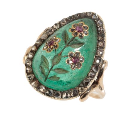 A 19TH CENTURY INDIAN EMERALD, DIAMOND AND RUBY RING the emerald carved as a spray of flowers set with rubies and old-cut dia