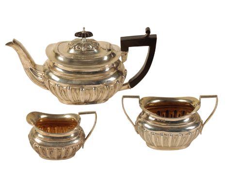 A LATE VICTORIAN SILVER THREE PIECE BACHELORS TEA SERVICE by William Aitken, Chester 1898, comprising teapot, cream jug and s