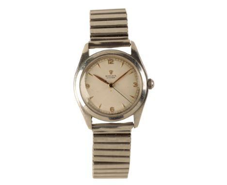 ROLEX OYSTER: A GENTLEMAN'S STAINLESS STEEL WRISTWATCH with manual wind movement, the silver dial with gold baton and Arabic 